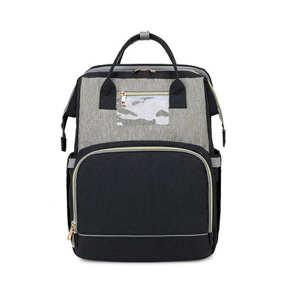 The All-in-One Travel Diaper Bag with Foldable Crib & Changing Station
