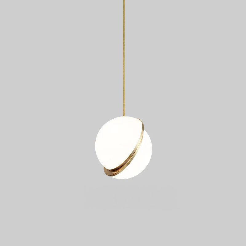 Modern pendant light with white shade and gold rim on a gray background