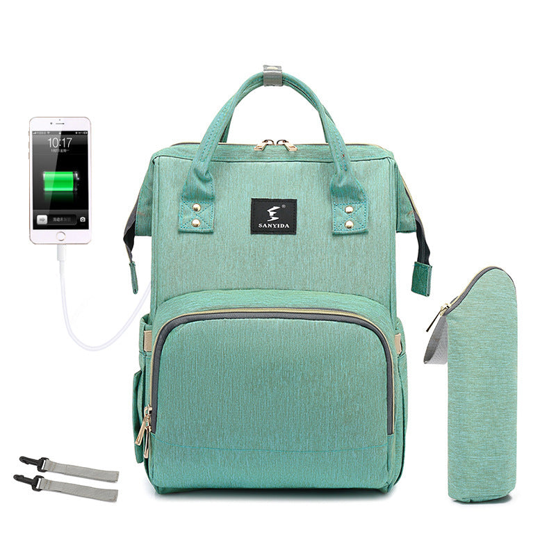 The All-in-One Travel Diaper Bag with Foldable Crib & Changing Station